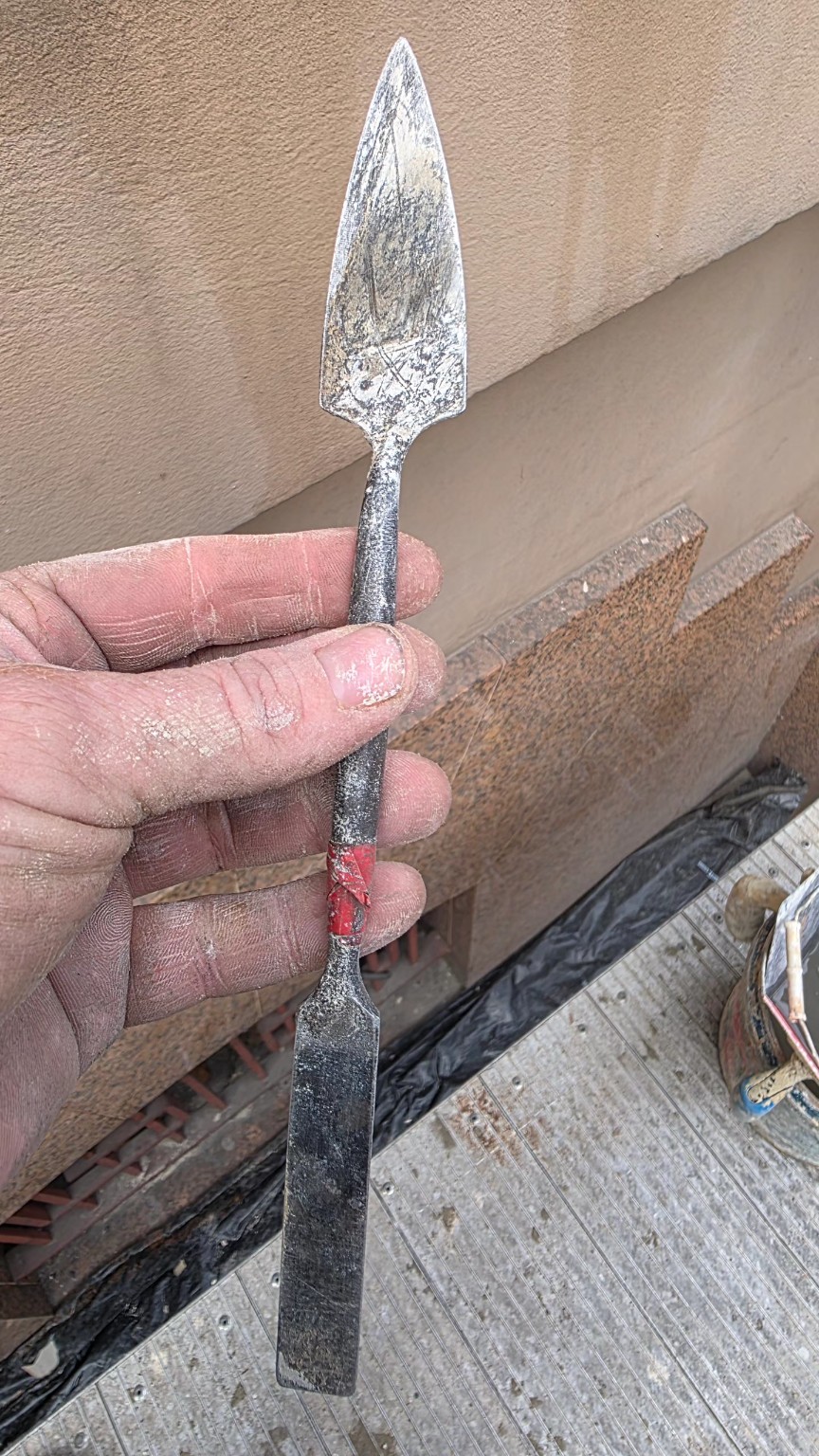 Detail plastering trowel during render work