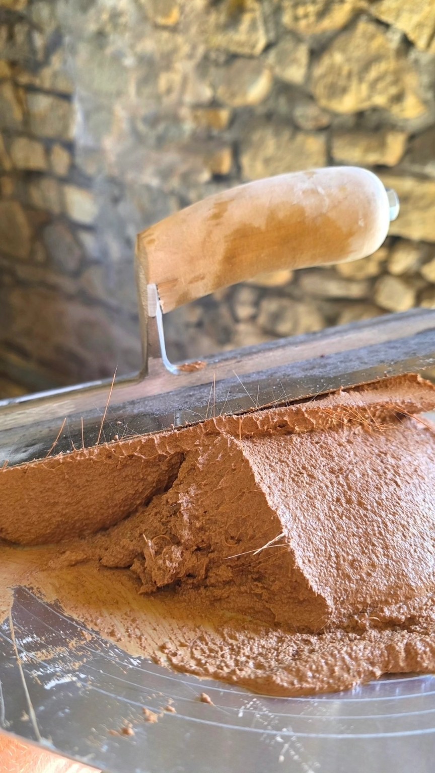 Lime plaster on a hawk with a trowel